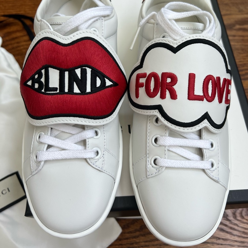 Gucci 'Blind for Love' embroidered snap-on patch leather sneaker in white.